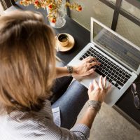 Person using a laptop to search an online lawyer register